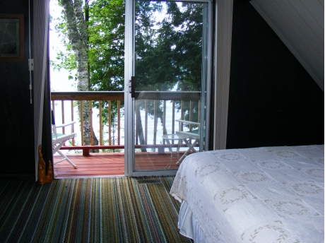 The upstairs bedroom overlooking the lake