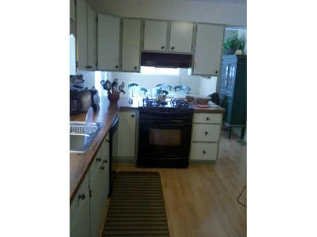 Modern well stocked kitchen with a dishwasher 