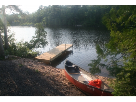 Our dock, beach and canoe