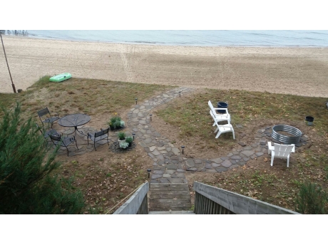 View of lower yard with eating area and fire pit (Summer 2017)