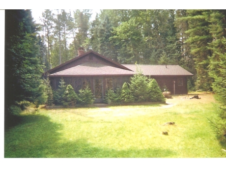 Back side of house with view of screened porch