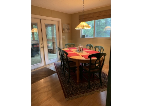 Dining table and a bar counter for additional seating 