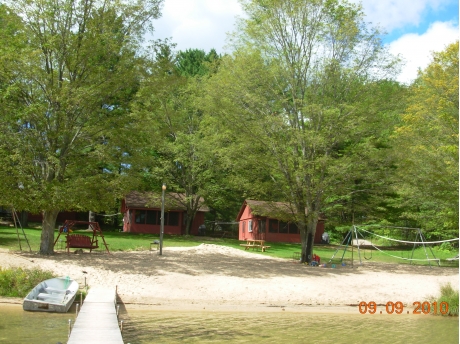 View from the end of the dock with our aluminum row boat available for each cabin.