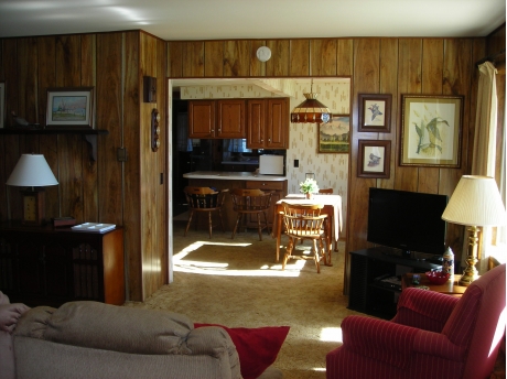 View from living room through dining room to kitchen